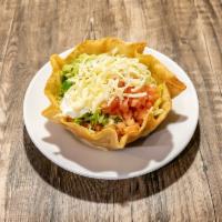 Taco Salad · Beef or chicken, rice, beans, lettuce, tomatoes, shredded cheese, sour cream, and guacamole ...