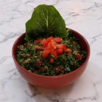 Tabouleh · Chopped parsley, tomatoes, onions, mint, bulgur and lemon olive oil dressing. Vegan.
