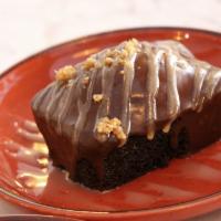 Tahini Dark Chocolate Cake · Chocolate ganache and sesame seed brittle.