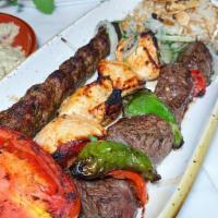 Mixed Grill · Chicken shish taouk,kafta kebab,steak kebab and served with rice.