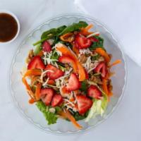 Strawberry Chicken Salad   ·  Romaine lettuce, spinach, grilled chicken strips, sliced strawberries, sliced carrots, waln...