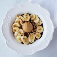 Peanut Butter Acai Bowl · Acai, banana, blueberries and almond milk with peanut butter, banana and granola.