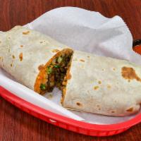 Lonestar Burrito · Served in a traditional jumbo flour tortilla with your choice of meat, refried pinto beans, ...