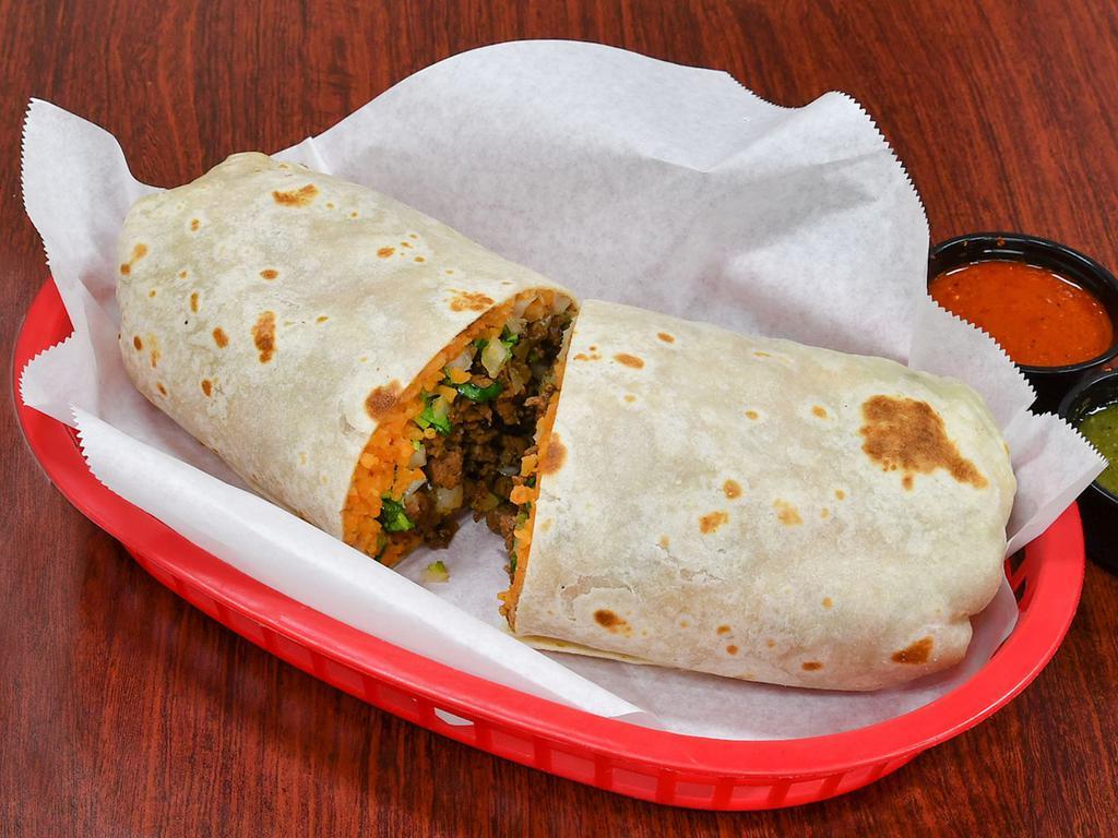 Lonestar Burrito · Served in a traditional jumbo flour tortilla with your choice of meat, refried pinto beans, seasoned Mexican rice and fresh chopped cilantro and onion.