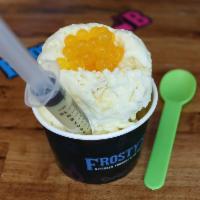 Mango Mania · Ice mango, shredded coconut, popping boba mango and a condensed milk syringe.