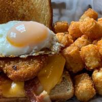 Breakfast Burger · American cheese, hashbrowns, sunny side up egg, bacon and Texas toast.