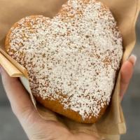 Ponchik · Deep-fried dough with a filling of custard, Nutella or apricot jam. Topped with powdered sugar
