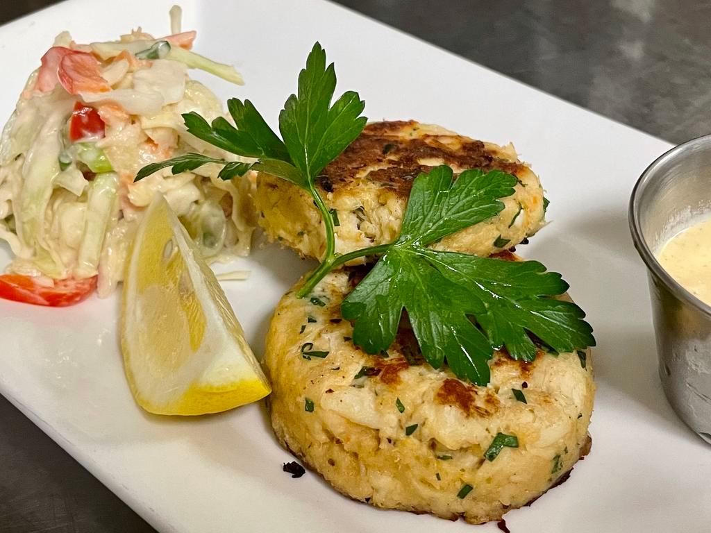 Crab Cakes · two lump crab and butter cracker cakes, with apple slaw and housemade remoulade on the side