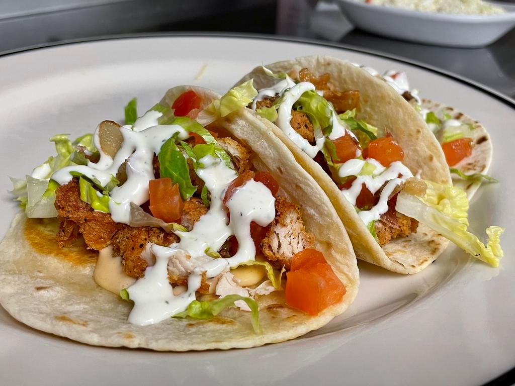 BLT Chicken Tacos · hand cut, battered to order chicken tenders on flour tortillas with chipotle queso, bacon, shredded lettuce, roma tomatoes and ranch, served with veggie rice