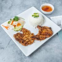 C2-Grilled Pork Chop Special · Com bi suon nuong đac biet. White rice served with grilled pork chop, shredded pork skin, fr...