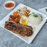 CR2-Grilled Short Rib Combo · Com suon dai Han đac biet. Korean short ribs, grilled shrimp, and a fried egg accompanied wi...