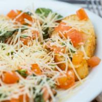 Bruschetta · Fresh Roma tomatoes diced with fresh basil, olive oil and a touch of garlic with Parmesan ch...