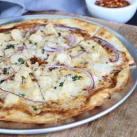 BBQ Chicken Pizza · BBQ sauce, gouda, mozzarella, caramelized onion, and chicken, topped with cilantro.