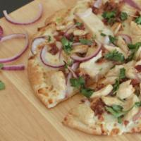 Chicken Bacon Ranch Pizza · Garlic ranch, diced white meat chicken, crumbled bacon, sliced red onion.