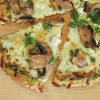 Pesto Mushroom Pizza · Pesto sauce, gouda, mozzarella, Parmesan, mushroom, and goat cheese.