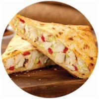 Chicken Pesto Panini · Grilled chicken, roasted red peppers, and melted mozzarella cheese over creamy pesto sauce.
