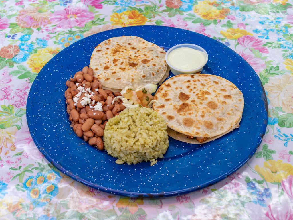 QUESADILLAS POBLANAS · Two Quesadillas served with your choice of meat, grilled poblanos and a blend of queso Oaxaca and Monterey. Served with pinto beans and cilantro rice. 