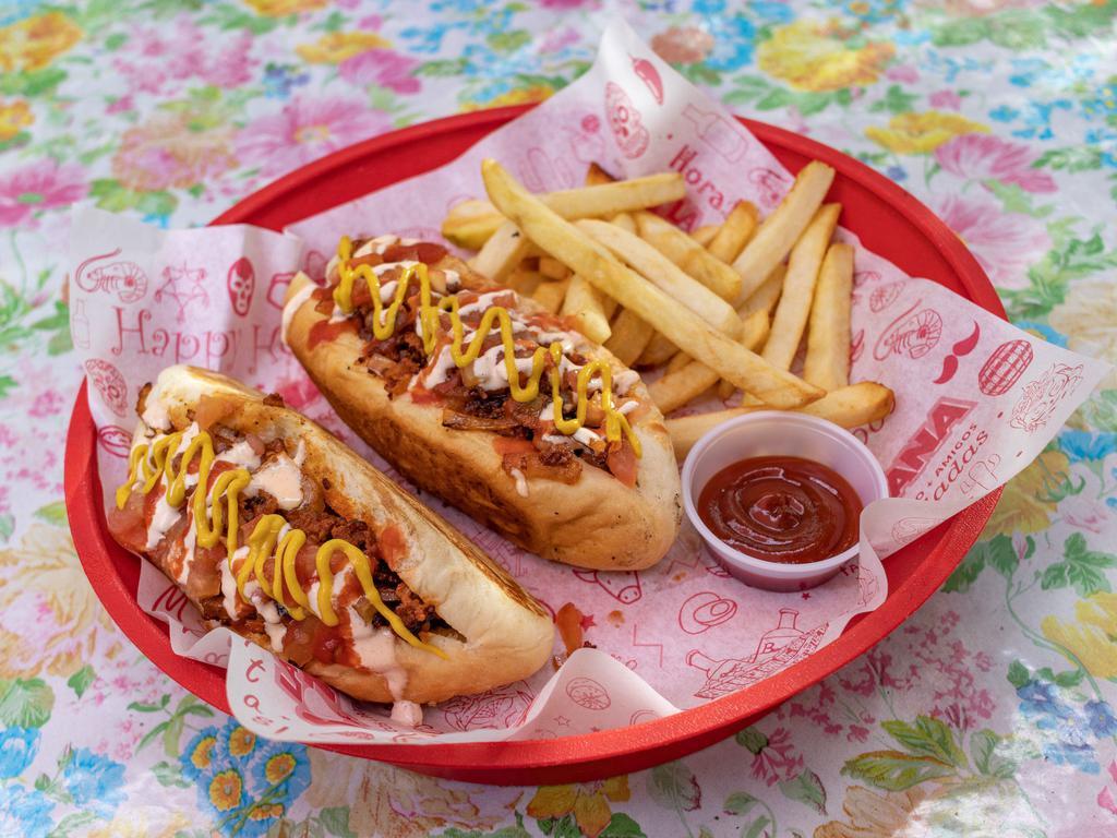 Sonoran Hotdogs · Two Sonoran botana dogs with bacon, mustard, chorizo, mayo, grilled onions, tomatoes, whole beans, and a side of fries.