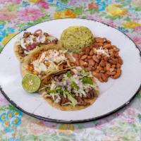 THREE AMIGOS TACOS · Three soft tacos with your choice of tortillas and meat or veggie option, finished with garn...