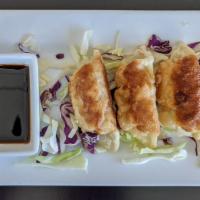 4 Chicken Potsticker · Pan-fried vegetable and chicken dumplings served with soy chili dipping sauce.
