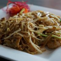 Pad Thai · Stir-fried rice noodles with egg, green onion, bean sprouts, and ground peanut in a tangy sa...