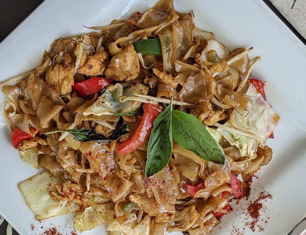 Drunken Noodles · Stir-fired wide rice noodles with bean sprouts, cabbage, bell pepper, onion and sweet basil leaf in chili garlic basil paste. Vegetarian option available.