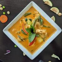 Panang Curry · Peanut coconut red curry, with bell pepper, green bean or zucchini, and sweet basil leaf. 