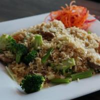 Bangkok Street Fried Rice · Stir-fried jasmine rice with egg, broccoli, green onion and onion and tomato, in-house soy b...