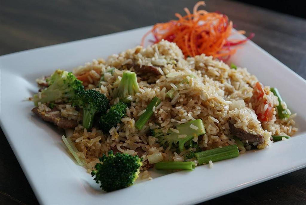 Bangkok Street Fried Rice · Stir-fried jasmine rice with egg, broccoli, green onion and onion and tomato, in-house soy blend. Vegetarian option available.