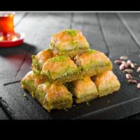 Baklava (Pistachio) · Baked pastry of phyllo dough with pistachio and drenched with syrup, served with 3-pieces