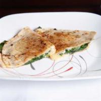 Texas Quesadilla Fajita · Tender shoulder steak, grilled chicken, butter grilled shrimp seasoned with spices; sauteed ...