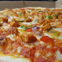 Tandoori Chicken Pizza · BBO'd the Indian way. Homemade dough, orange curry, topped with special blend of cheeses, ta...