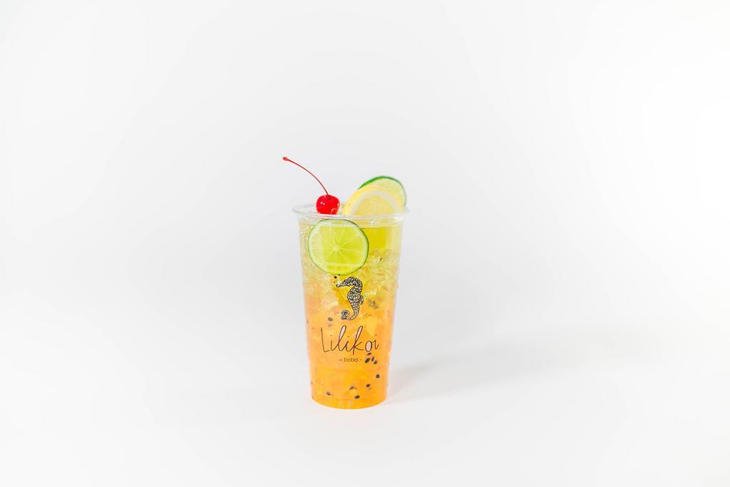 Tropical Delight · Tropical puree (mango, pineapple, passion fruit) topped with green tea (jasmine), can substitute with lemon lime tea for caffeine free option. 24oz.