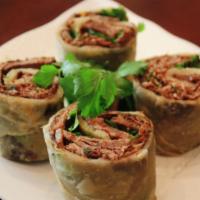 Beef Burrito 手抓饼卷酱牛肉 · Flour tortilla with a savory filling.