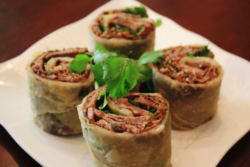 Beef Burrito 手抓饼卷酱牛肉 · Flour tortilla with a savory filling.