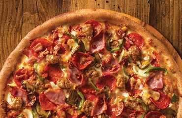 The Works Pizza · Pepperoni, ham, green peppers, Italian sausage, mushrooms, bacon, onions, our original sauce and signature 3 cheeses.