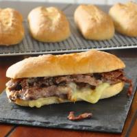Philly Cheesesteak · Grilled sirloin, white American cheese, and grilled onions on a hoagie roll.