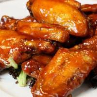 Buffalo Wings · Marinated, baked, fried, then tossed and sauced.  Available in 4 different sizes with option...