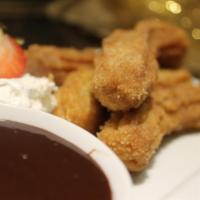 Housemade Churros · Made to order and abuelita’s chocolate dipping sauce.