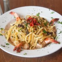 Linguine Pescatore · Pasta with fresh Manila clams, shrimp, calamari and mussels in white wine garlic tomato sauce.