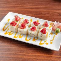 Osaka Roll · Raw. Crabmeat, jalapeno, cream cheese, tobiko, and spicy tuna in soy paper. Topped with spic...
