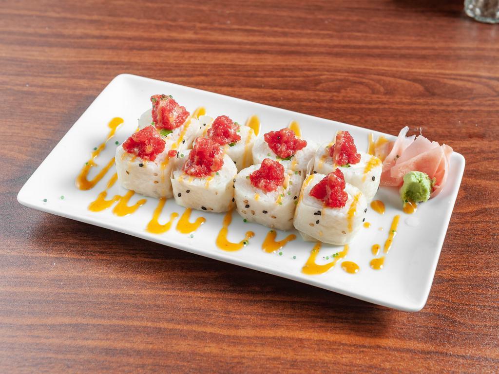 Osaka Roll · Raw. Crabmeat, jalapeno, cream cheese, tobiko, and spicy tuna in soy paper. Topped with spicy mayo.
