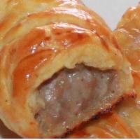 Sausage Roll · Seasoned sausage meat encrusted in a puff pastry.