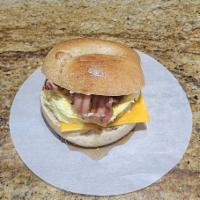The Frenchie Sandwich · Cinnamon bagel, egg, choice of sausage or bacon, maple syrup, choice of cheese, cinnamon van...