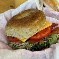 The Farm Favorite Sandwich · Spinach parm bagel, tomato, sprouts, spinach, cucumber, choice of cheese, chive and onion cr...