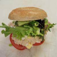 The Big Catch Sandwich · Honey wheat bagel, tuna, lettuce, tomato, onion, pickles, your choice of cheese. 
