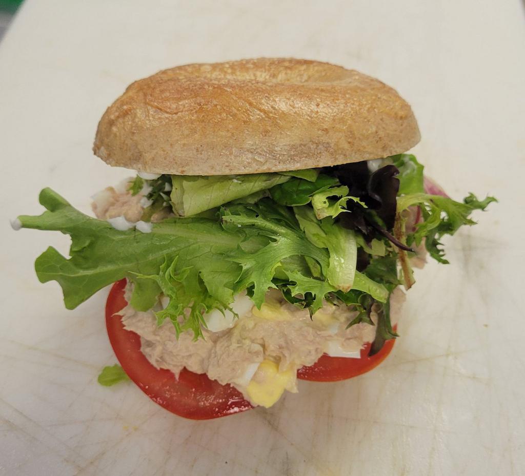 The Big Catch Sandwich · Honey wheat bagel, tuna, lettuce, tomato, onion, pickles, your choice of cheese. 