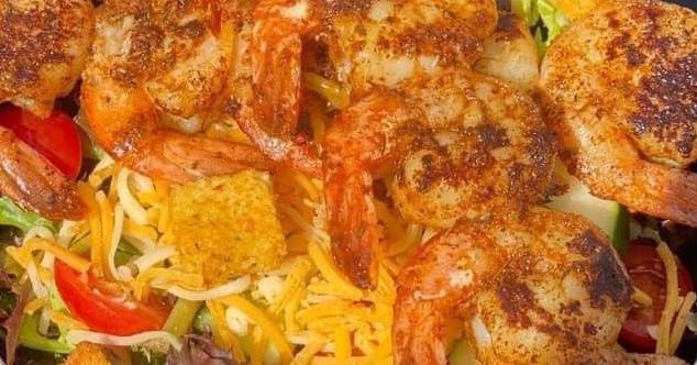 Grilled Shrimp House Salad · Lemon peppered or blackened shrimp on salad mix with cucumbers, grape tomatoes, cheddar Jack cheese, croutons and ranch dressing.