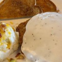 Chicken Fried Steak · Topped with white gravy and served with mashed potatoes, side salad and toast.