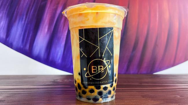 Tiger Thai Tea · Freshly brewed Thai tea sweetened with condensed milk, tiger walls, and chewy brown sugar boba